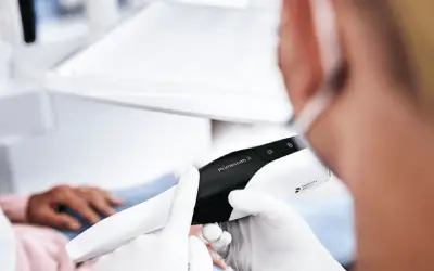 dentist using primescan digital impression scanner technology during patient visit