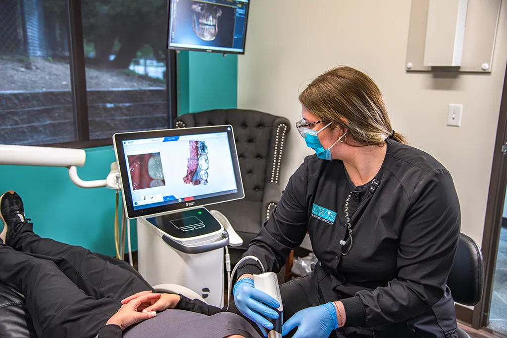 Dentistry professional using a dental scanner