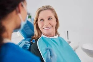 Woman smiling after successful all-on-4 dental implant procedure at Lewis Family & Implant Dentistry in Vancouver WA