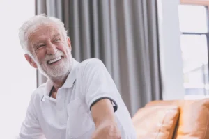 A man smiling after successful all-on-X dental implant procedure at Lewis Family & Implant Dentistry in Vancouver WA